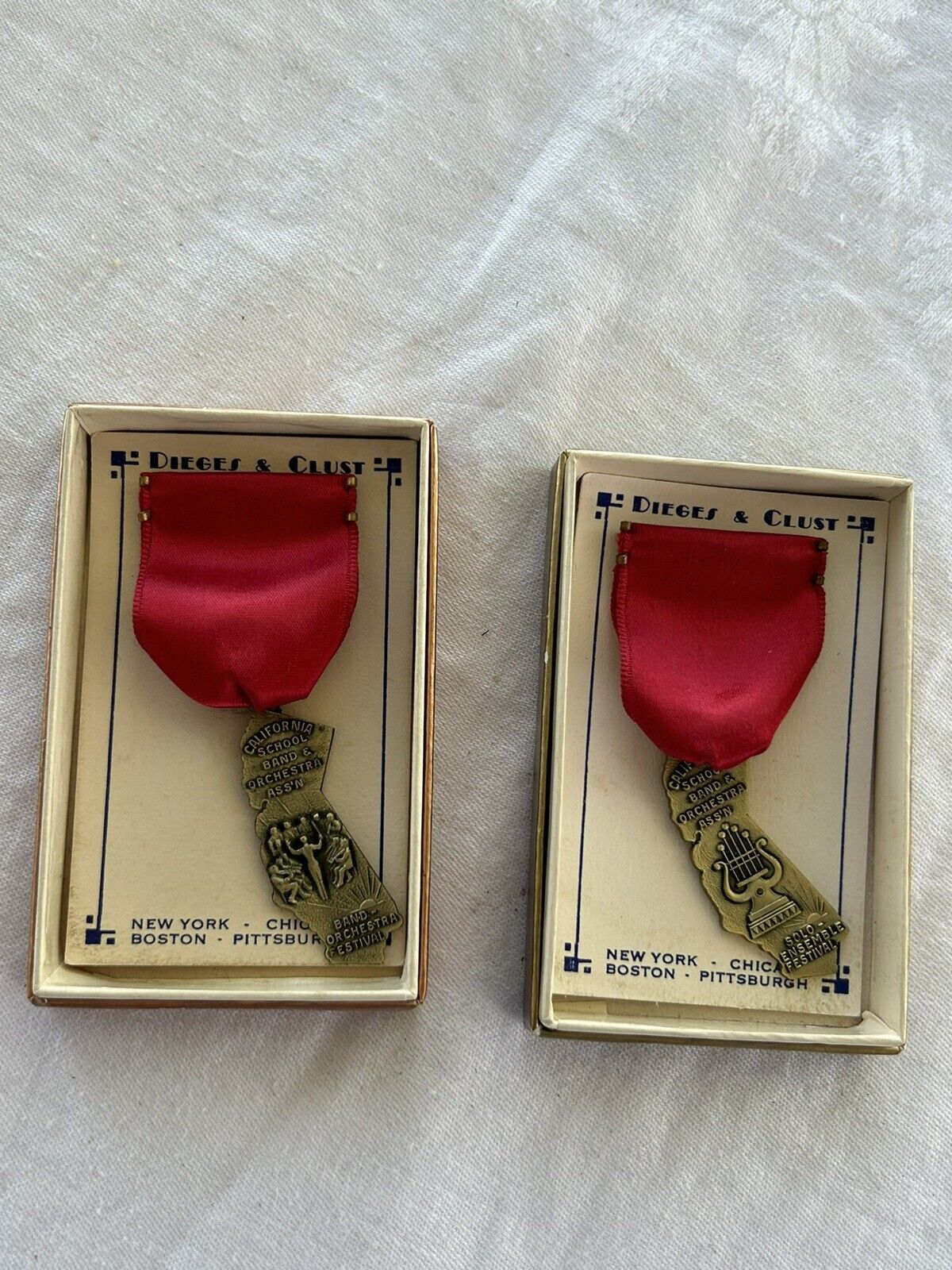 Lot of 2 VINTAGE DIEGES & CLUST CALIFORNIA SCHOOL MUSIC/BAND MEDALS Original Box