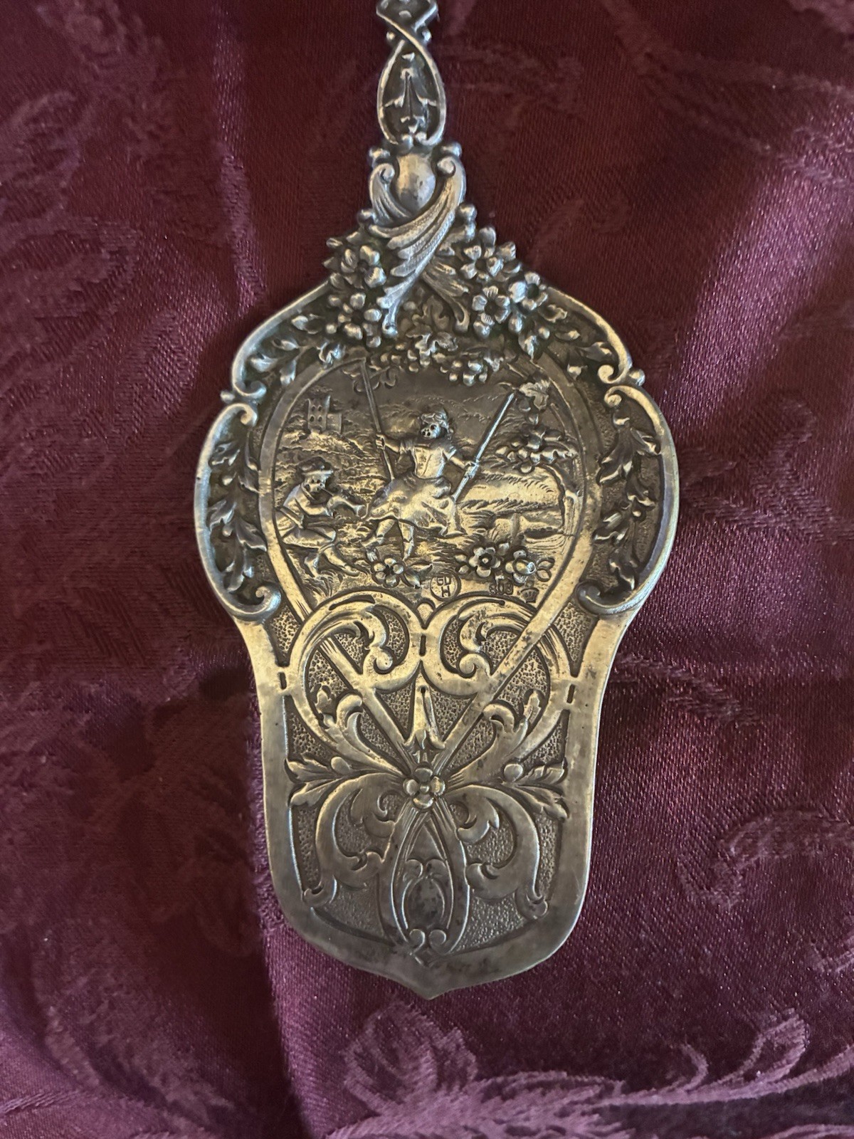 Antique German silver serving utensil with ornate design Antique German silver serving utensil with ornate design