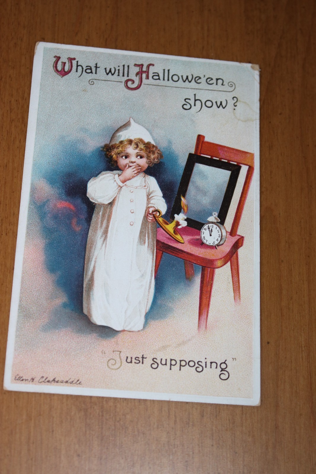 Antique Clapsaddle Halloween Postcard with girl, mirror, candle clock Antique Clapsaddle Halloween Postcard with girl, mirror, candle clock