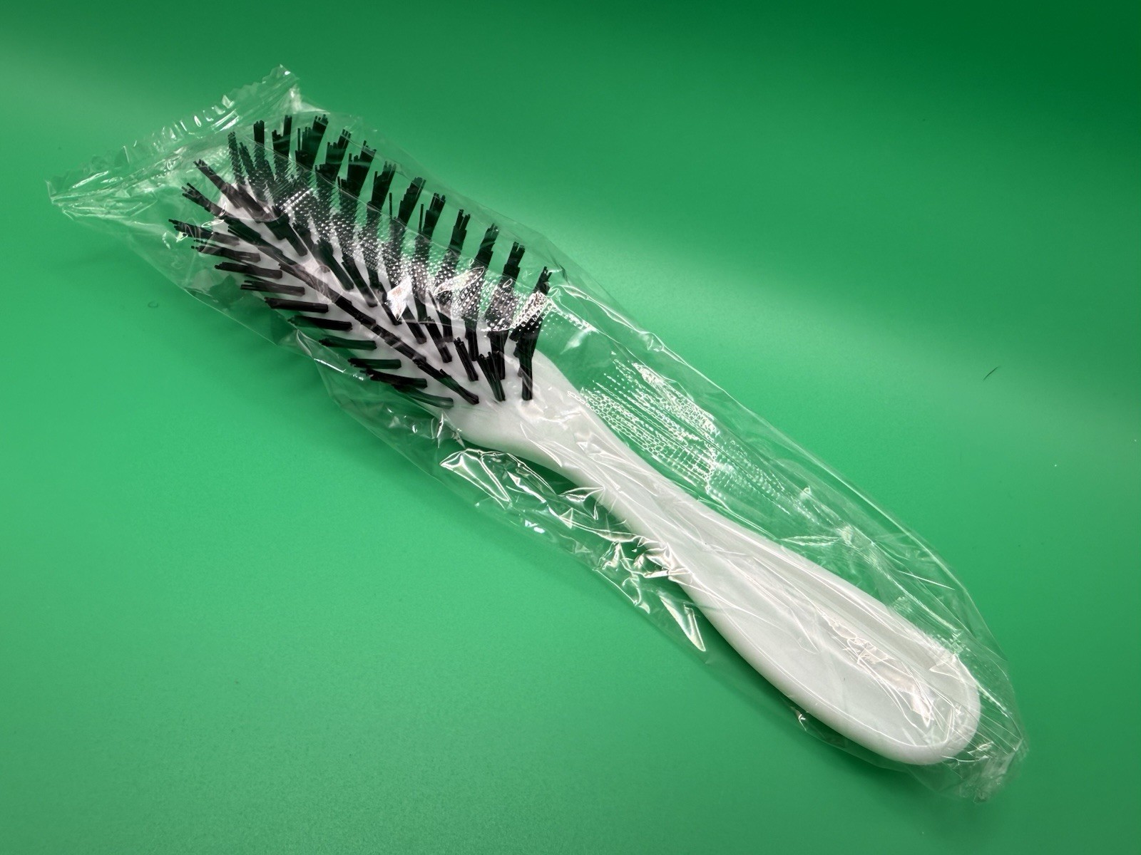 New Vintage White Plastic 7” Hairbrush With Black Nylon Bristles New Vintage White Plastic 7” Hairbrush With Black Nylon Bristles