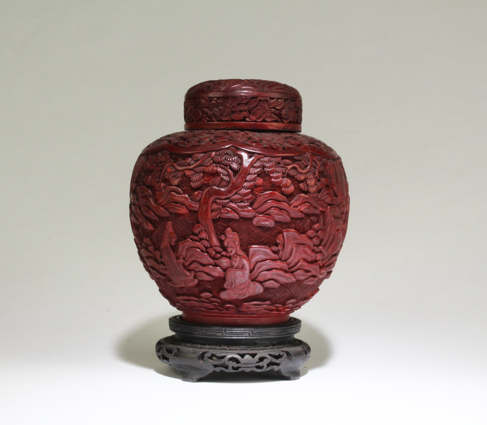 A Cinnabar Lacquer Container. Comes fitted with a wooden stand A Cinnabar Lacquer Container. Comes fitted with a wooden stand