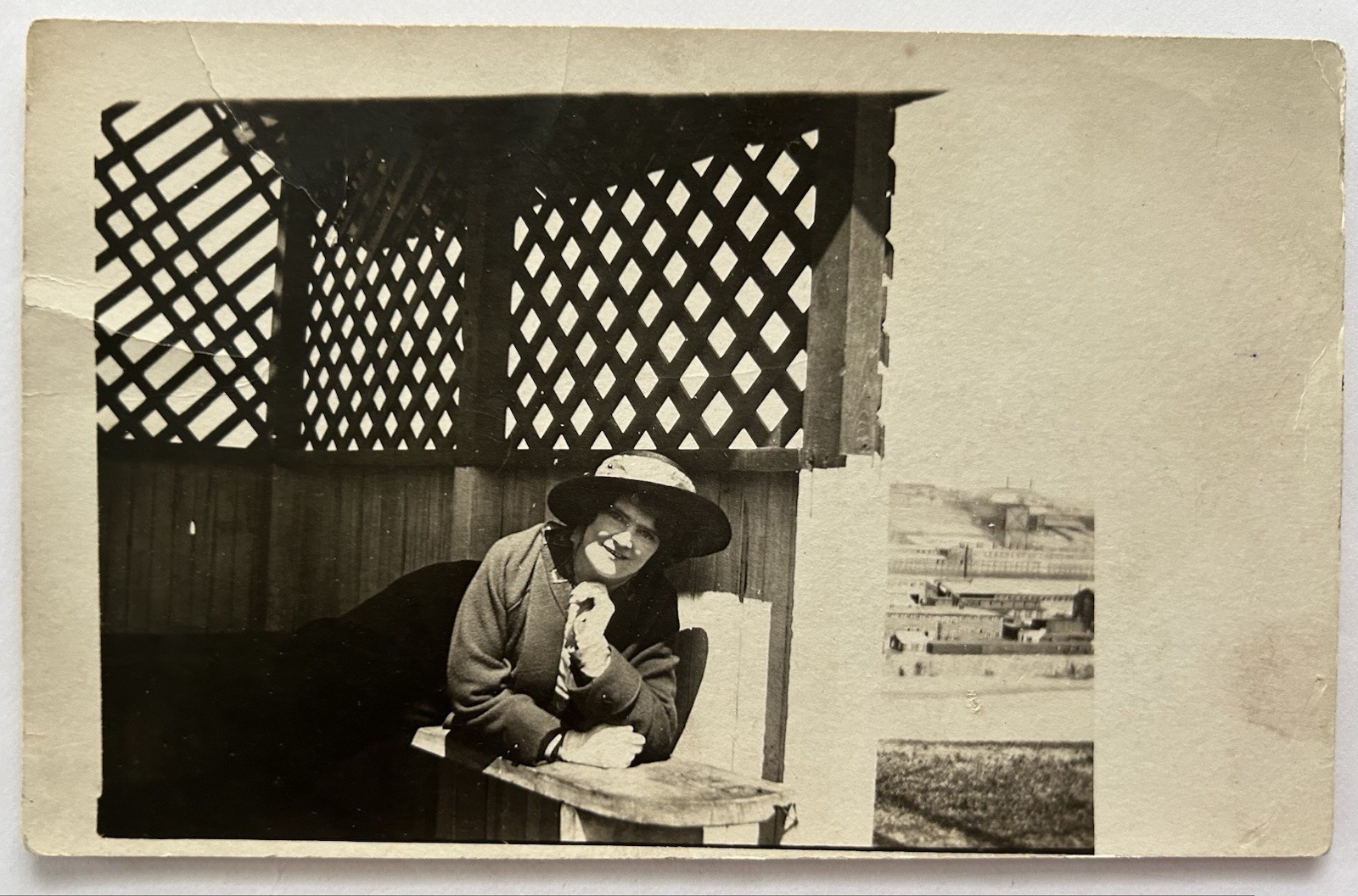 Vintage RPPC - Woman In Hat Lounging In Lattice Gazebo | Photo Postcard