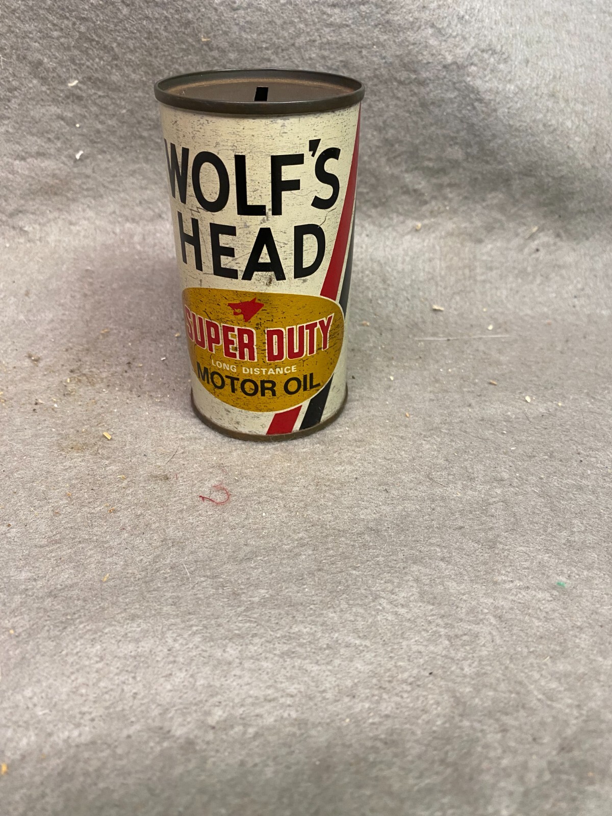 VINTAGE 4 INCH WOLF'S HEAD MOTOR OIL METAL BANK VINTAGE 4 INCH WOLF'S HEAD MOTOR OIL METAL BANK