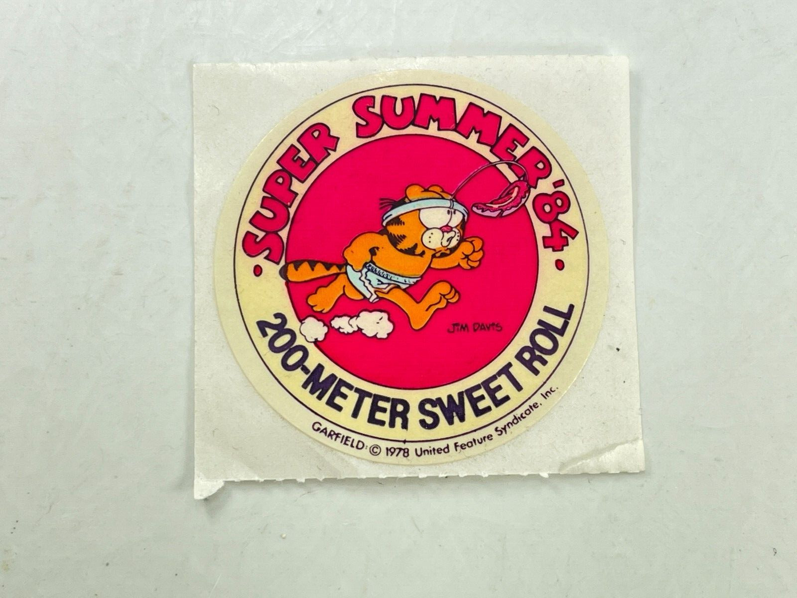Vintage 1984 United Syndicate Garfield Summer Games Sticker 200-Meter Sweet Roll Vintage 1984 United Syndicate Garfield Summer Games Sticker 200-Meter Sweet Roll