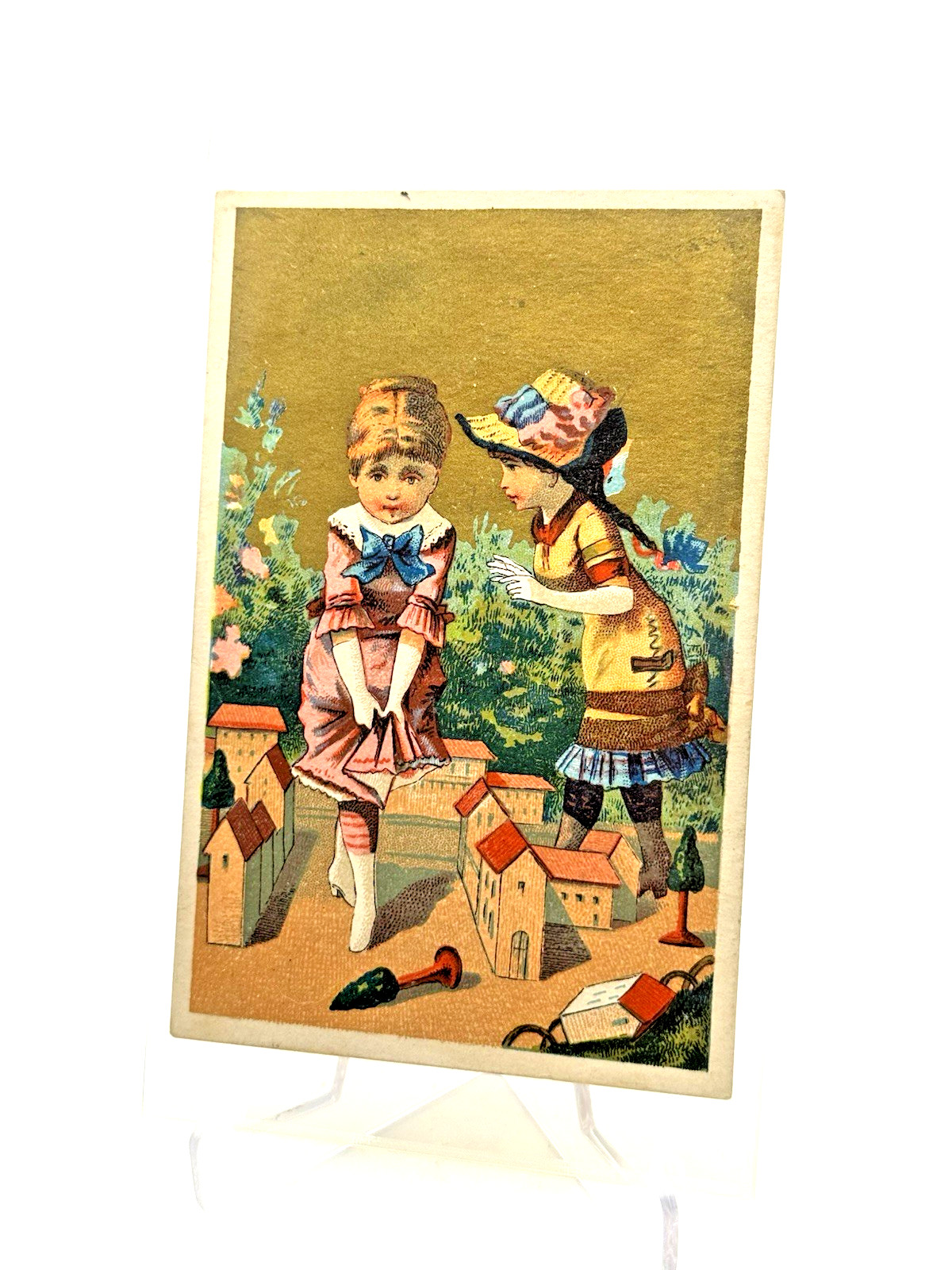 Antique 1880s Victorian Chromolithograph Trade Card Girls Playing in Toy Town Antique 1880s Victorian Chromolithograph Trade Card Girls Playing in Toy Town