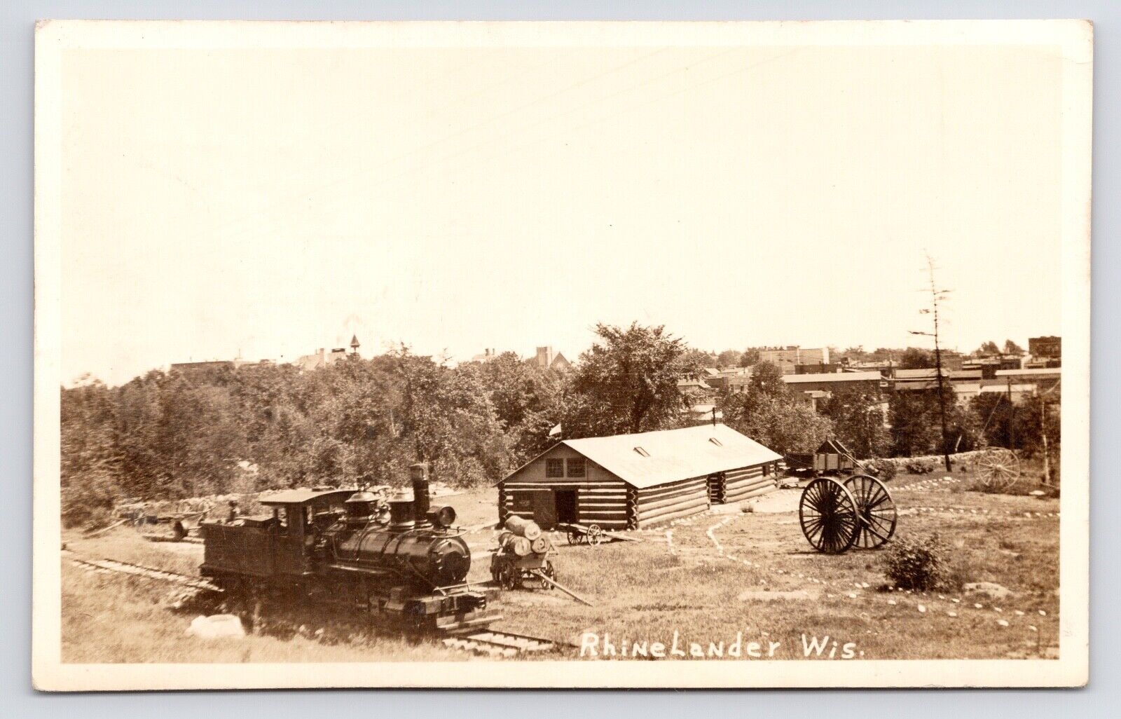 c1930s~Rhinelander Wisconsin Wi~Locomotive Train~Cabin~Rural Scene~RPPC Postcard