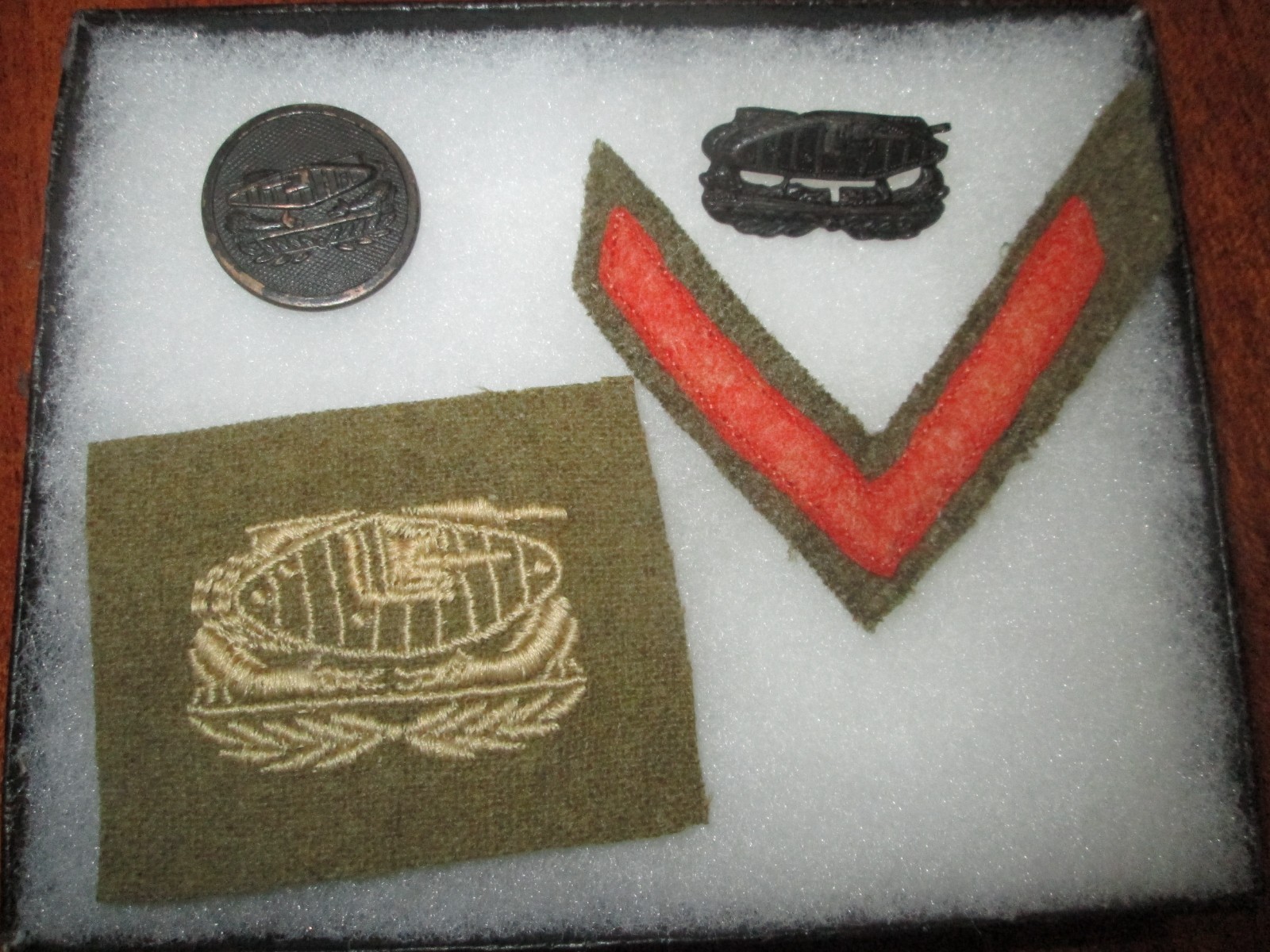 Original WWI U.S. tank corps disc, hat pin, patch, and overseas stripe Original WWI U.S. tank corps disc, hat pin, patch, and overseas stripe