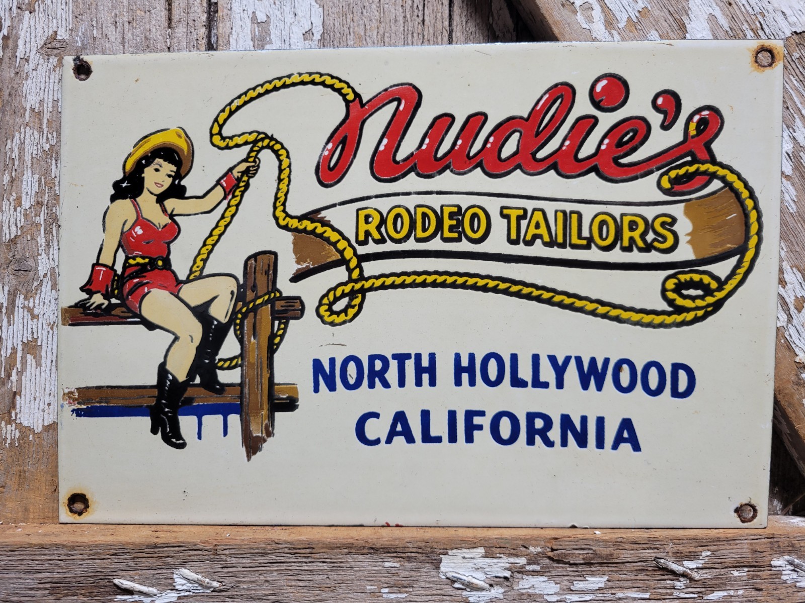 VINTAGE NUDIES PORCELAIN SIGN RARE OLD RODEO TAILOR HOLLYWOOD CALIFORNIA COWGIRL VINTAGE NUDIES PORCELAIN SIGN RARE OLD RODEO TAILOR HOLLYWOOD CALIFORNIA COWGIRL