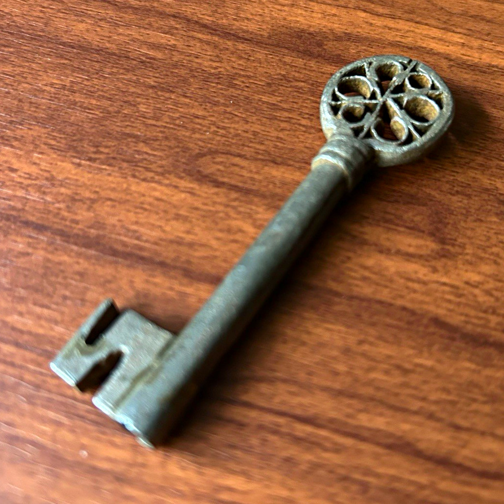 Antique, cathedral window bow key. Rare, and ornate. 