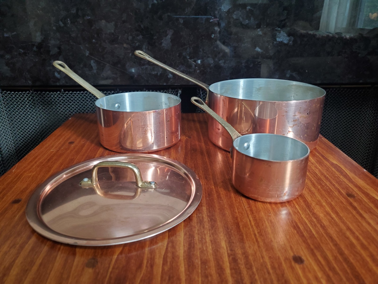 Lot of three small Vintage copper sauce pans. Lot of three small Vintage copper sauce pans.