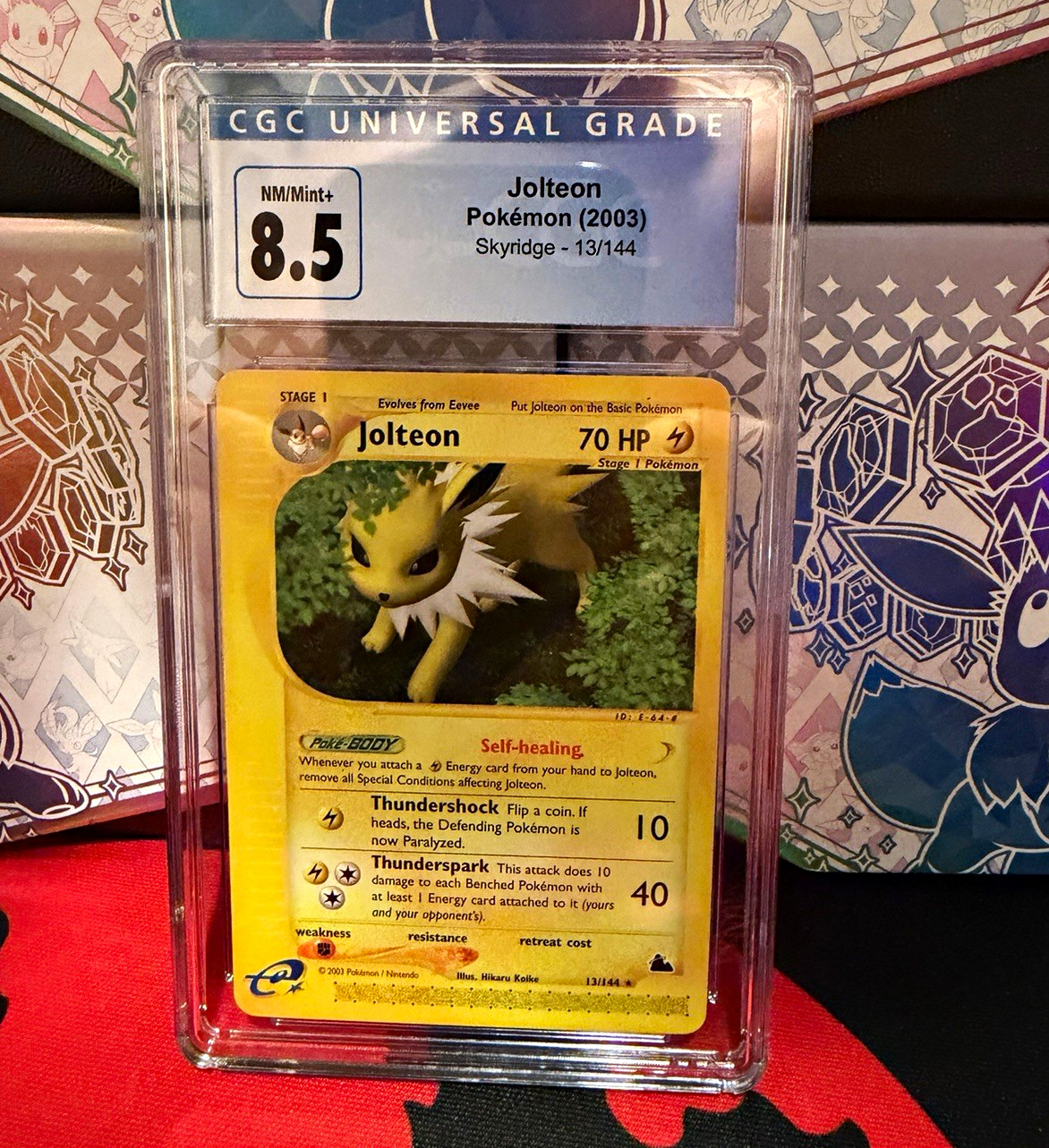 Pokémon 2003 Jolteon Skyridge #13/144 CGC 8.5 Cert 4101783275 Pokémon 2003 Jolteon Skyridge #13/144 CGC 8.5 Cert 4101783275
