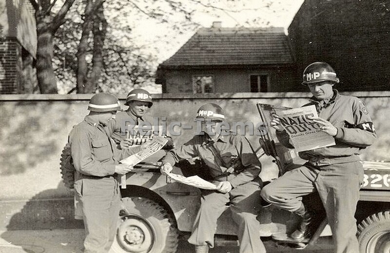 WW2 Picture Photo US military policemen read about the German surrender 1123 WW2 Picture Photo US military policemen read about the German surrender 1123