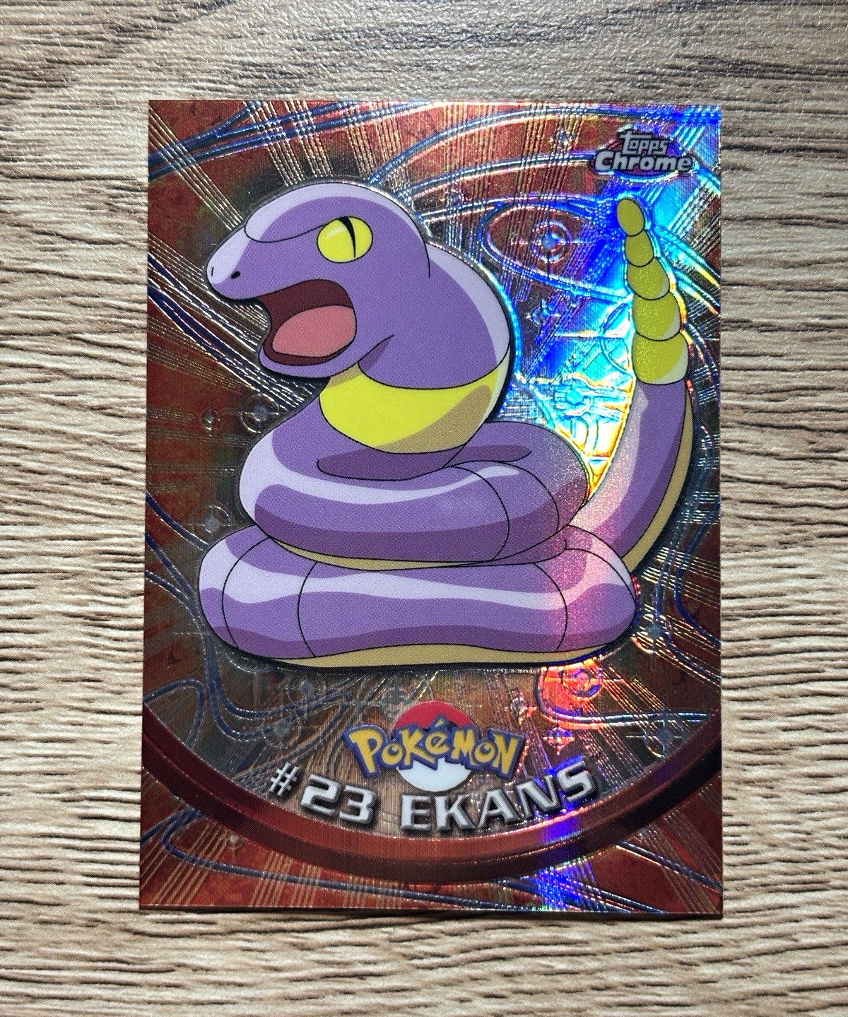 Topps Pokémon Spectra-Chrome Chrome #23 Ekans Trading Card 1999 English Topps Pokémon Spectra-Chrome Chrome #23 Ekans Trading Card 1999 English