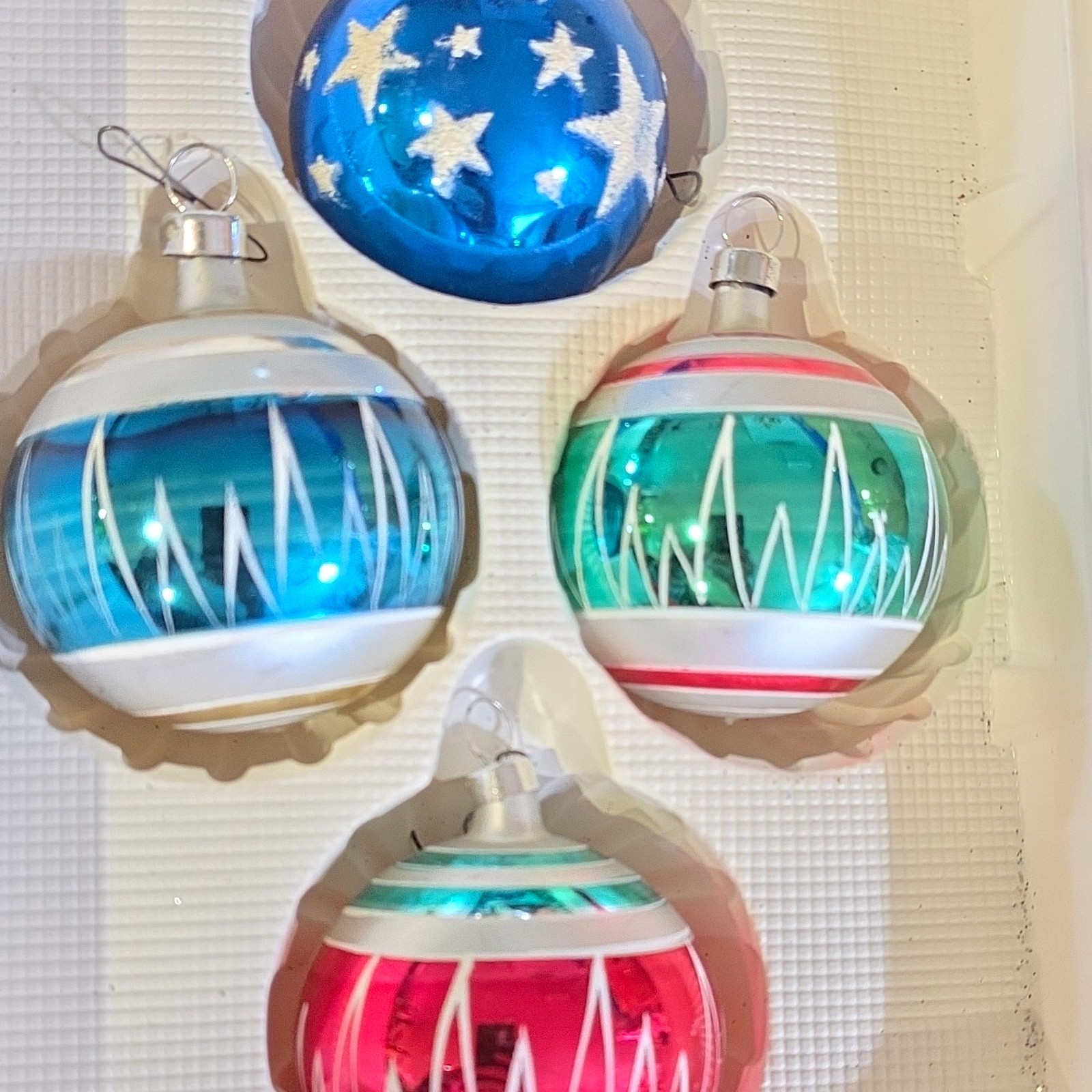 These are 4 mid-century baubles. These are 4 mid-century baubles.