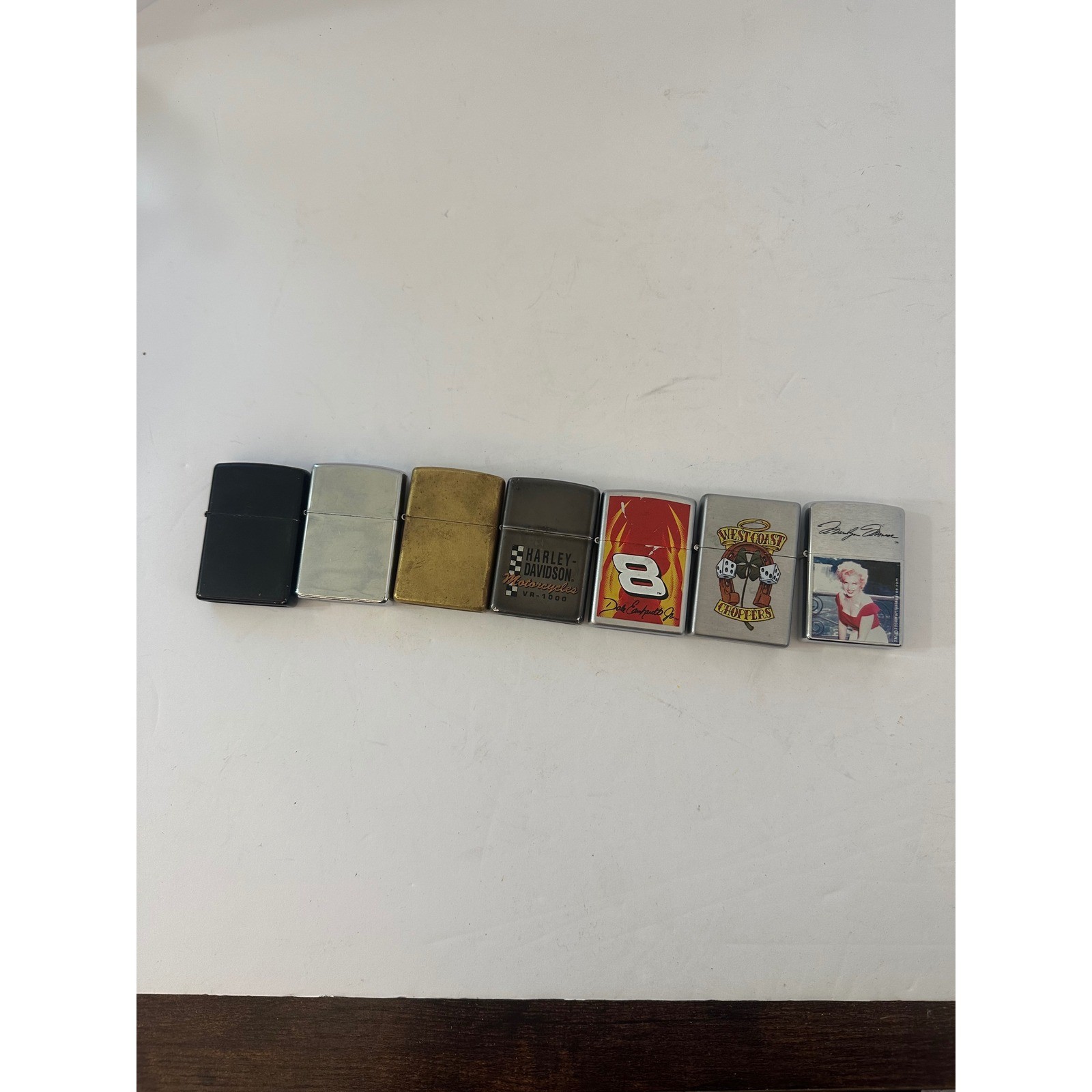 Lot of 7 Zippo Lighters Harley-Davidson Marilyn Monroe Dale Earnhardt Jr Vintage
