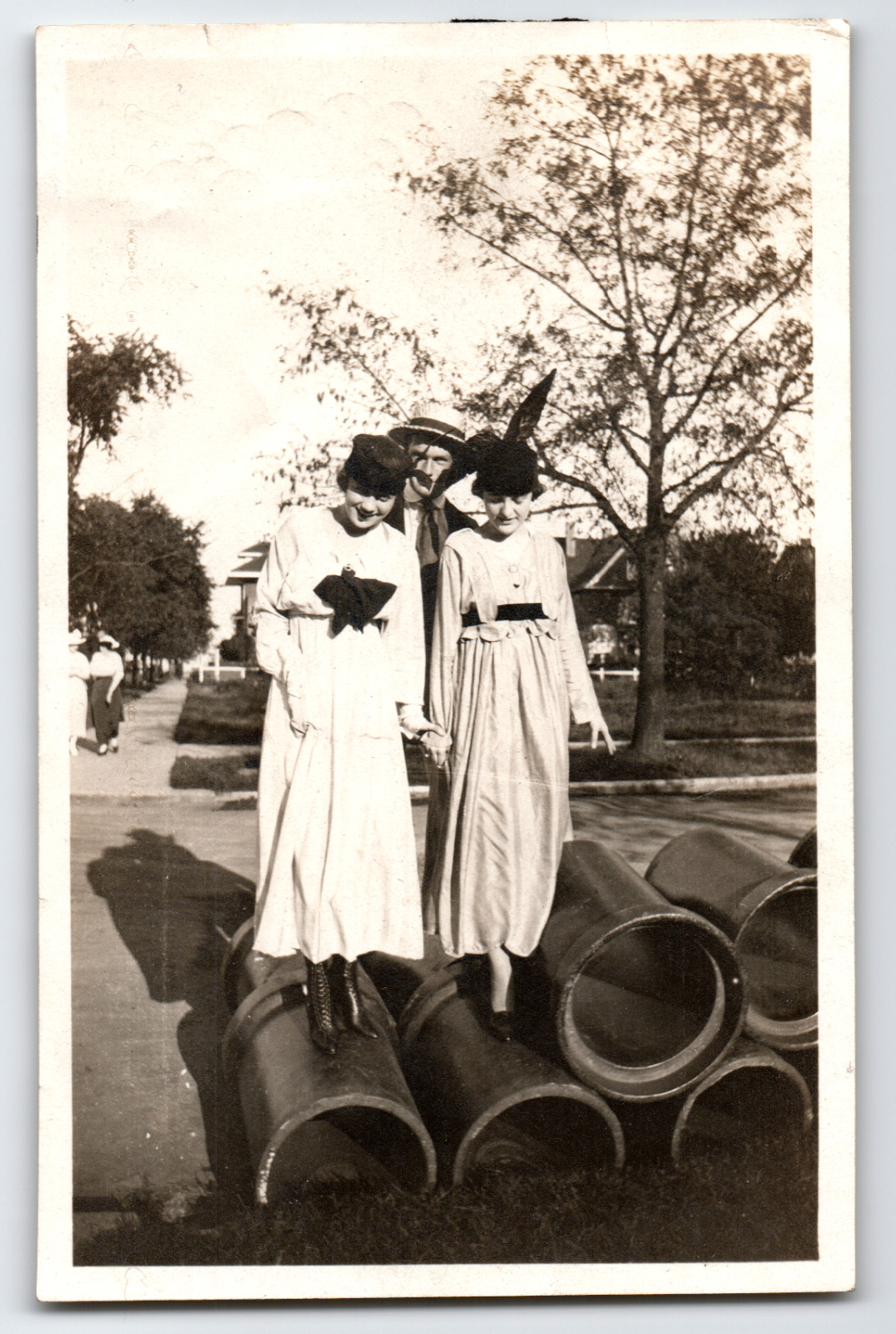 Photo Two Women and Man Balancing on Pipes Fashion Vintage 1910s Photo Two Women and Man Balancing on Pipes Fashion Vintage 1910s