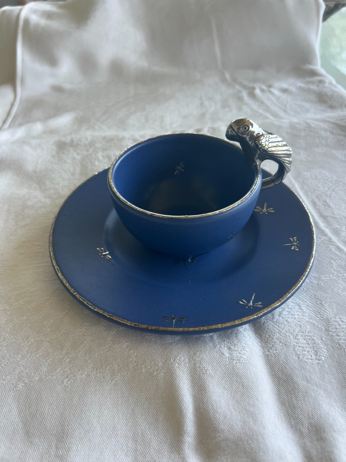 Emilia Castillo cup & saucer blue ceramic w/silver inlay and bird handle Emilia Castillo cup & saucer blue ceramic w/silver inlay and bird handle