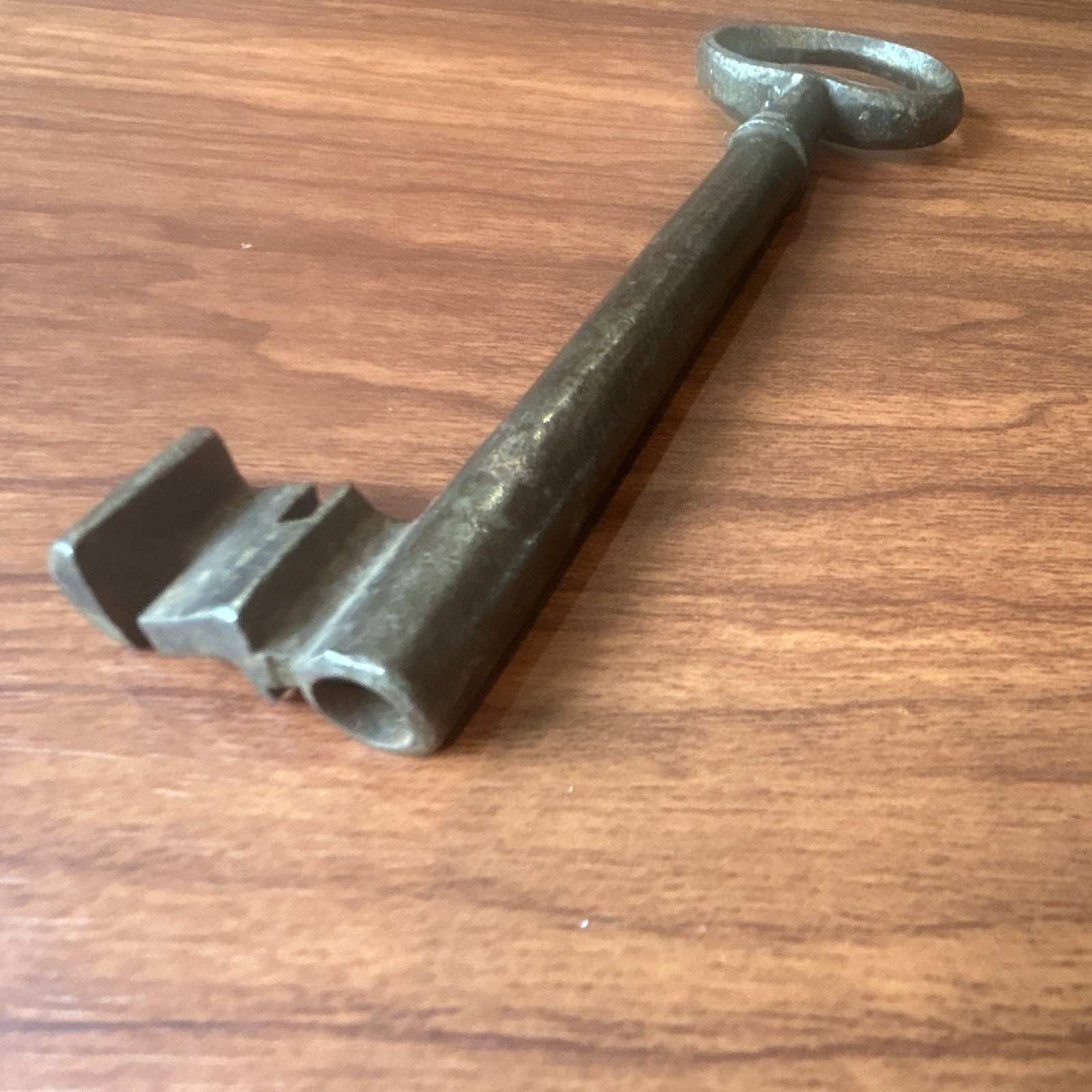 Large antique metal skeleton key with oval bow, old-style vintage key Large antique metal skeleton key with oval bow, old-style vintage key
