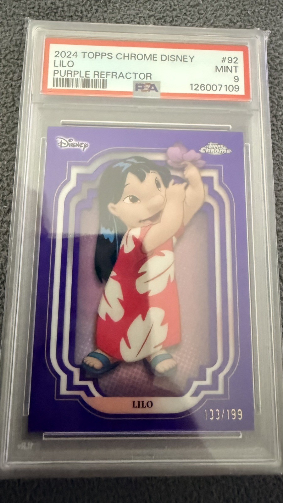2024 Topps Chrome UK Disney Lilo #92 Purple Refractor /199 – PSA 9 MINT – POP 6 2024 Topps Chrome UK Disney Lilo #92 Purple Refractor /199 – PSA 9 MINT – POP 6