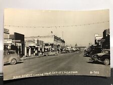 Postcard Main Street Shelby Montana Real Photo Store Fronts Old Cars Texaco picture