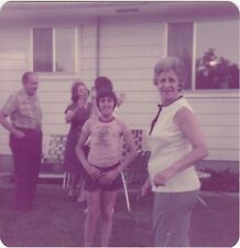 Vintage 1975 Found Photo - Boy With Family In Yard Smiles At Port Huron Michigan picture