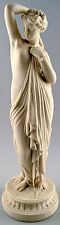 Antique large biscuit figure of semi-nude woman in classical style. picture