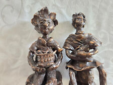 Pair of Hand Made Painted Clay Statues picture
