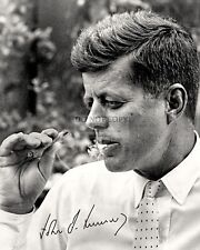JOHN F. KENNEDY SMOKES CIGAR IN 1963 w/ FACSIMILE SIGNATURE - 8X10 PHOTO (RP025) picture