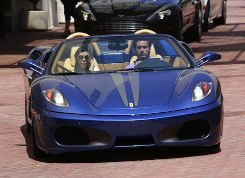 Scott and Kourtney Kardashian in a Ferrari Scuderia