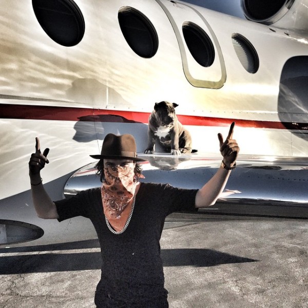 Alec Monopoly With His DOg on  Private Jet