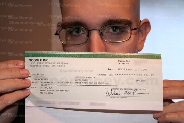 Jeremy Schoemaker shows off his check