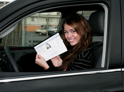 Miley Cyrus shows off  driver's permit.