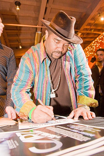 Sir-Mix-Alot signs autographs at the party.