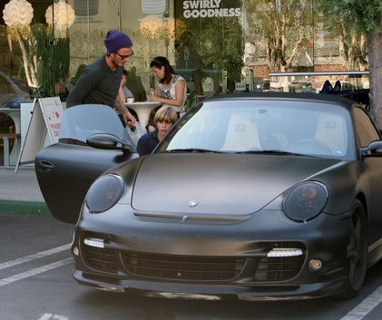 David Beckham taking a spin to pinkberry in his Porsche