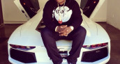 sean kingston sitting on a Lamborghini Aventador